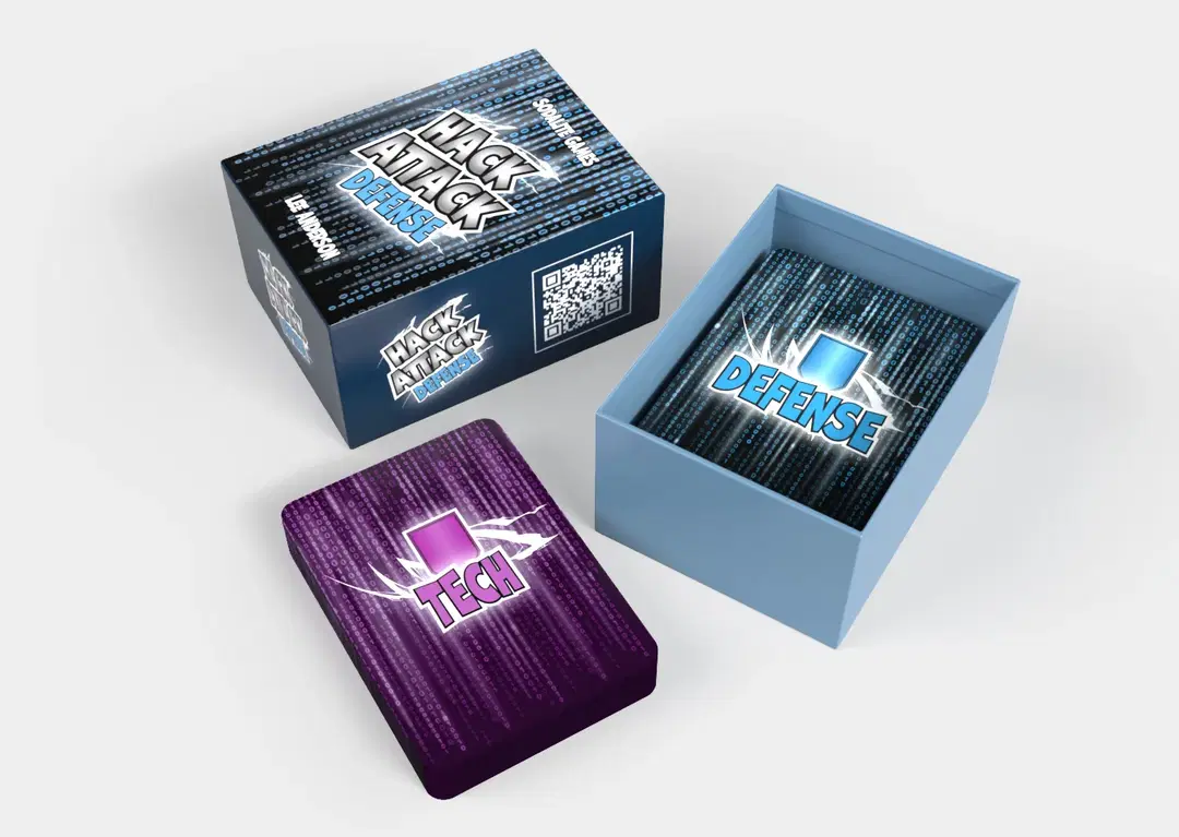 An open box of Hack Attack: Defense by Sodalite Games, showing the Defense and Tech decks